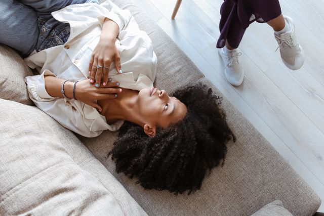 woman on couch receiving therapy